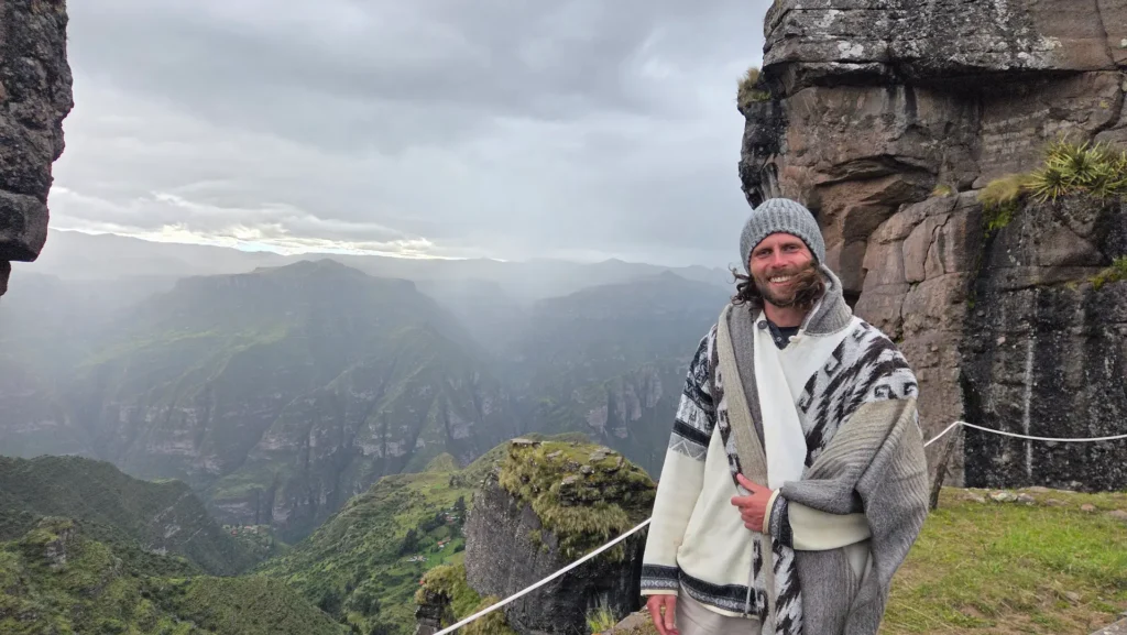 Standing at the summit of Incan Temple Waqrapukara with beautiful views of the surrounding mountains